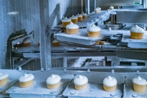 Food manufacturer insurance | Cupcake Manufacturer conveyor belt