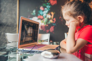 At home learning | School aged girl in front of computer taking a class | Huff Insurance | Pasadena, MD