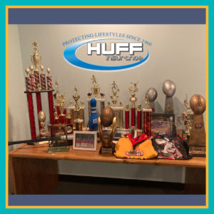 The Best Insurance Agents In Maryland Support Their Community- Youth Sports Trophy Table At Huff Insurance