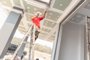Drywall Contractor Finishing Ceiling | Drywall Contractor Insurance from Huff Insurance in Pasadena, Maryland
