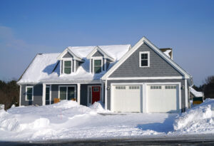 Home covered in snow for the Huff Insurance blog - Prepare Your Home For Winter