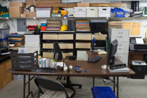Detached garage converted into a home office and business storage space with inventory, files, and equipment, highlighting detached structure insurance and homeowners insurance business use risks in Maryland by Huff Insurance.